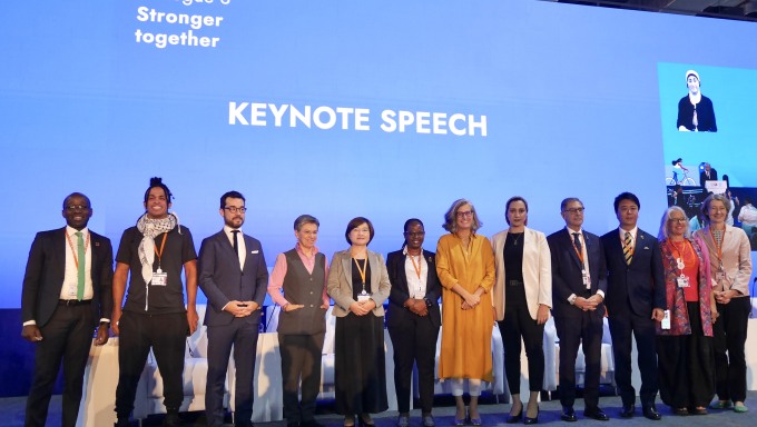 Speakers for Dialogue 3 gather for a group photo before the session begins  © UN-Habitat/Tiffany Chui